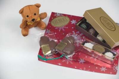chocolate gift assortment with small teddy bear