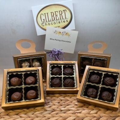 Assorted Gilbert Chocolates packaged four to a box.