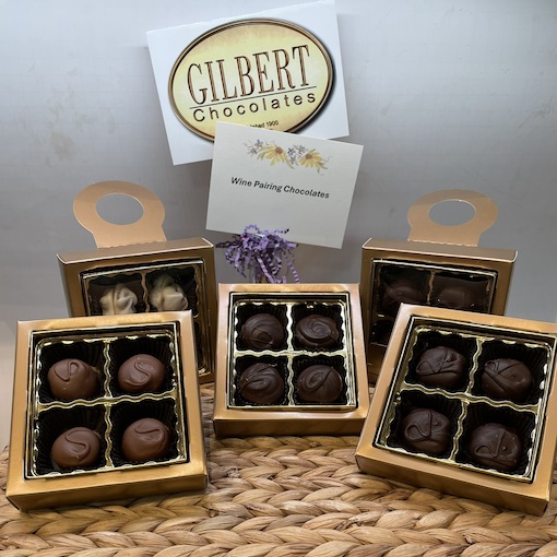 Assorted Gilbert Chocolates packaged four to a box.