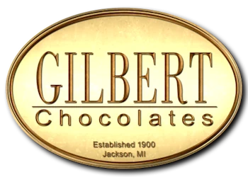 gilbert-chocolates-logo-webp Gold oval shape with Gilbert Chocolates text